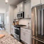 Stainless steel kitchen sink in a bright modern kitchen
