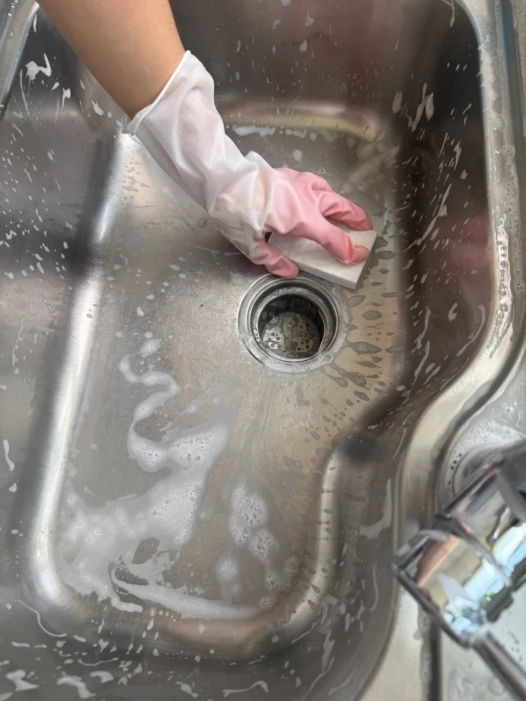 How to clean a stainless steel sink with dish soap and a soft sponge