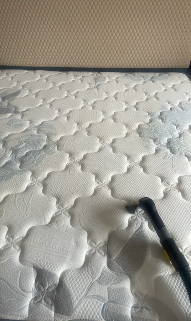 How to clean a mattress by vacuuming the surface and seams