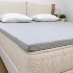 Memory foam topper on memory foam mattress in a bedroom