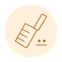 Cat litter scoop with scattered granules.