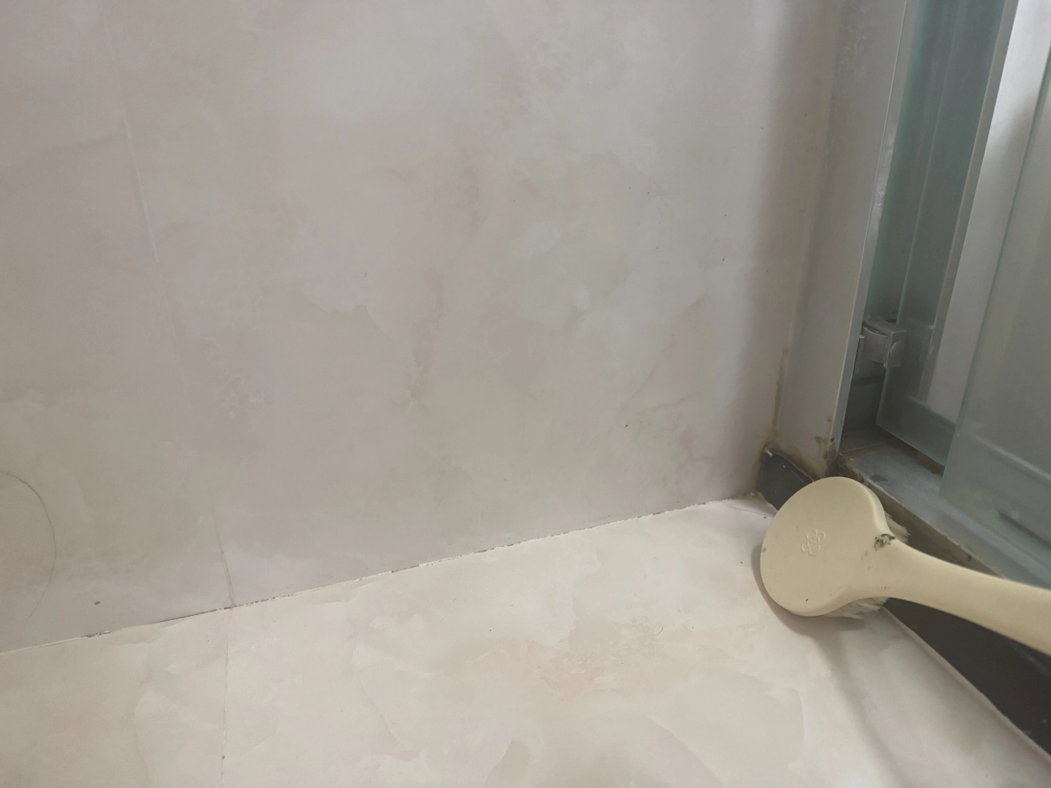 How to clean shower tiles around a glass shower door